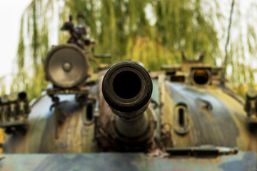 Fototapeta na wymiar Tank gun close up. Face of the war concept.