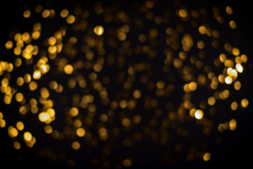 little gold stars on black background Festive holiday background. Celebration concept. Top view,...
