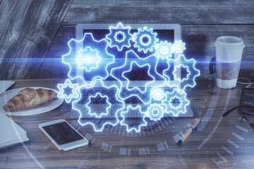 Multi exposure of business theme icons and work space with computer background. Concept of success.