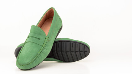 Green suede men moccasin isolated on white.