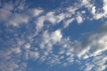Fototapeta premium Beautiful clouds in the blue sky on a spring day in the sunlight.