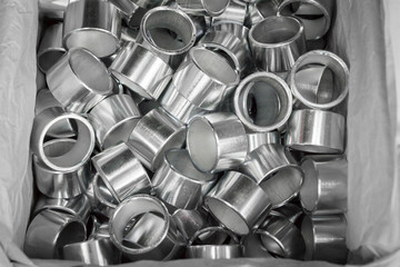 Steel sleeve. Details made lathe. Obtained on a lathe from steel and cast iron. Shallow depth of field. Parts stacked for further processing. Galvanized, coated part for anti-corrosion. Machined pipe