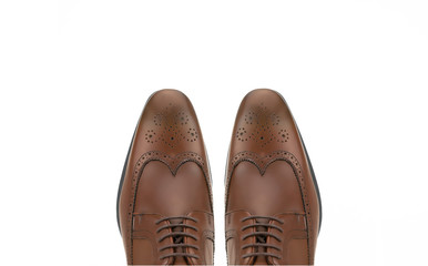 Brown brogue leather derby isolated on white background.