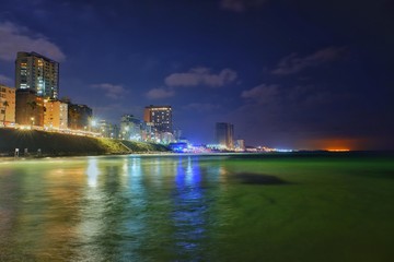 Fototapeta na wymiar Night view at beach and city