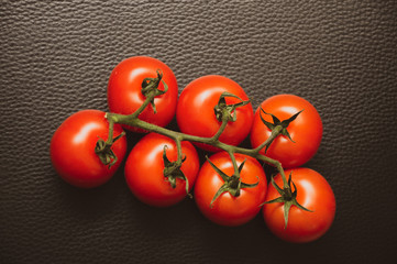 fresh tomatoes on black background