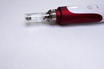 Dermis stamp electric pen. Dermapen. Needle mesotherapy treatment.