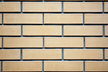 Brick wall background. Smoothly stacked bricks of brown color.