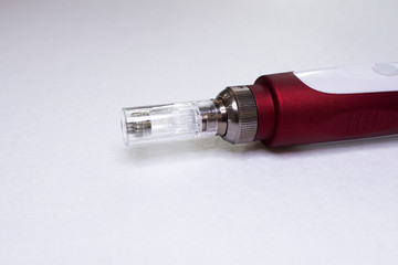 Dermis stamp electric pen. Dermapen. Needle mesotherapy treatment.