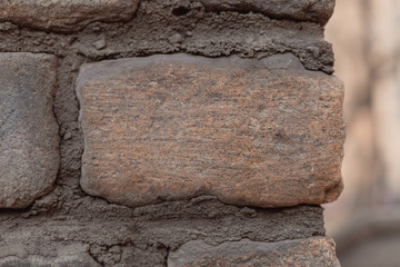 Gray brick wall with cement gaps. The old wall. Background, brick. Copy space. Photo background.