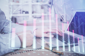 Multi exposure of stock market chart with man working on computer on background. Concept of financial analysis.