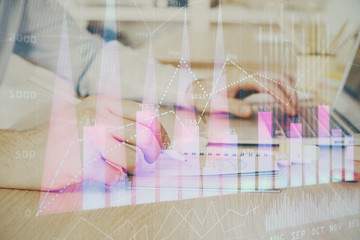 Multi exposure of financial graph with man works in office on background. Concept of analysis.