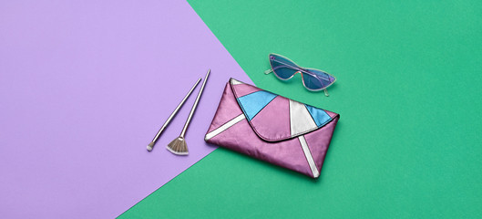 Fashion party girl Flat lay. Minimal. Woman Essentials accessories, cosmetic makeup. Trendy Clutch, sunglasses, brushes. Coloful purple mint Set. Creative pop art geometry concept, vibrant banner