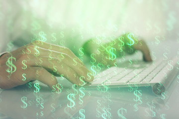 Double exposure of graph with man typing on computer in office on background. Concept of hard work.