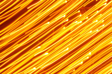 Futuristic blurred lights holiday monochrome background in yellow. Horizontal, soft focus