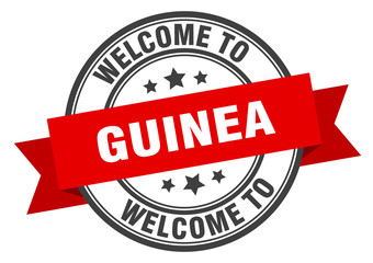 Guinea stamp. welcome to Guinea red sign