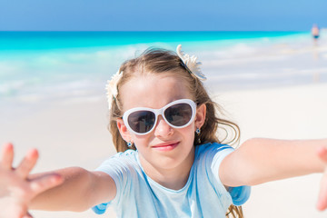 Fototapeta premium Happy kid looking at camera background beautiful sky and sea
