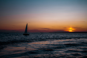 Fototapeta na wymiar Landscape yachts in the sea at sunset