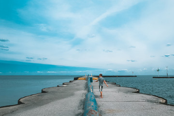 child walking on dock