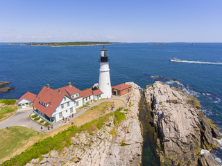 Fototapeta na wymiar Portland Head Lighthouse aerial view in summer, Cape Elizabeth, Maine, ME, USA. This lighthouse was built in 1791, and is the oldest lighthouse in Maine.