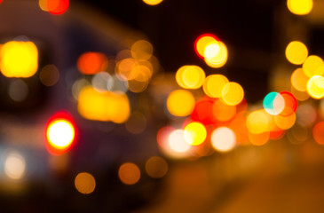 Blurred night city traffic lights background. Abstract urban road lights with bokeh effect.