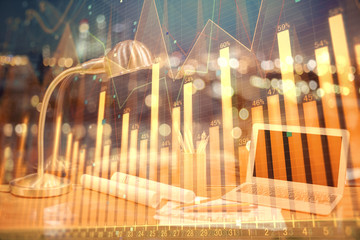 Financial chart drawing and table with computer on background. Double exposure. Concept of...