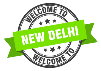 New Delhi stamp. welcome to New Delhi green sign