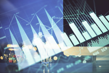 Forex market graph hologram and personal computer on background. Double exposure. Concept of investment.