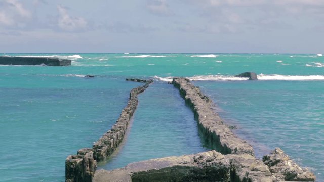 Destroyed old bridge in the beach