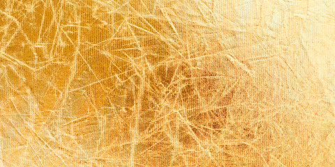 Fototapeta na wymiar Crumpled with creases golden fabric texture background