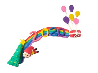 Beautiful rainbow decorated cute Santa Claus with snow Christmas tree number 2020 new year red gift box and colorful balloon are made from plasticine clay on white background, cute festival are dough