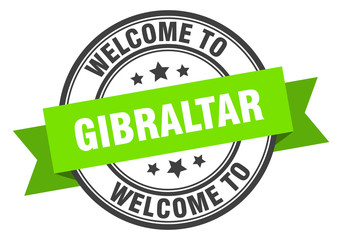 Gibraltar stamp. welcome to Gibraltar green sign