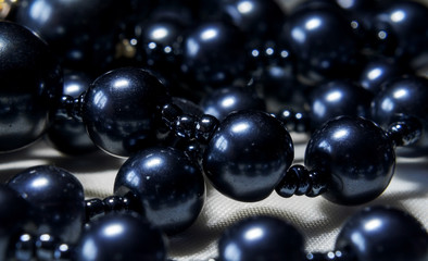 Jewelry, pearl beads photographed close-up, blurred background