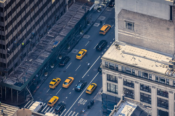Airstrip of New York City, with buildings and streets filled with the famous yellow taxis during the day. Concept of travel and transport. NYC, USA