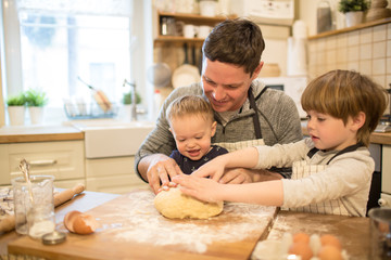 Dad and sons make cookies