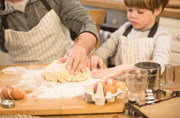 Dad and sons make cookies