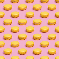 Seamless pattern with yellow macaron cookies on a pink background