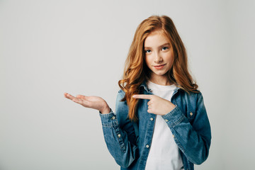 The red-haired girl in surprise points to a place for an inscription. She seems to have a wonderful idea.