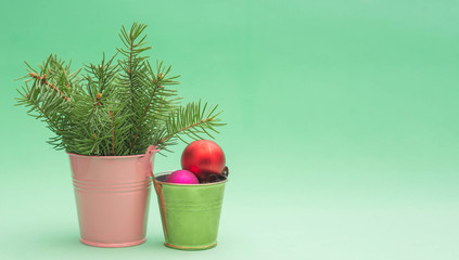 small buckets with fir branches and christmas toys