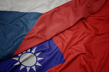 waving colorful flag of taiwan and national flag of czech republic.