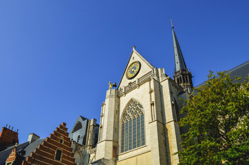 Fototapeta na wymiar Bell Tower of Leuven Church in Oude Markt Square (Belgium)