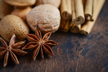 Christmas Spices and Nuts on a Wooden Table.