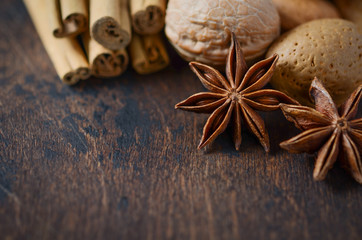 Christmas Spices and Nuts on a Wooden Table.