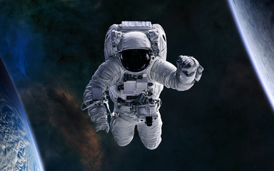 Astronaut in open space. Science fiction. Elements of this image furnished by NASA