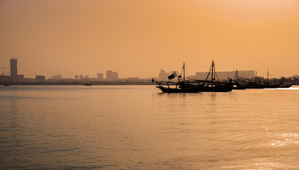 Fototapeta premium Doha Bay With Traditional Wooden Dhow Fishing Boats. View from Corniche, Doha, Qatar