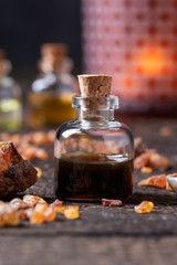 A bottle of myrrh essential oil with myrrh resin