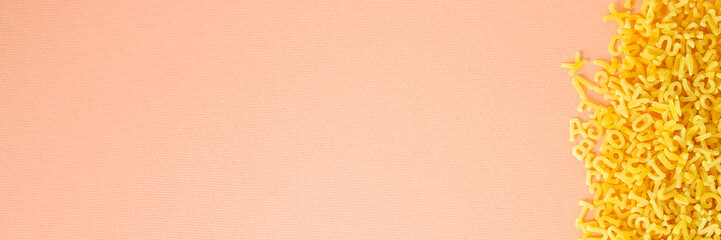 Pasta Alphabet (set of ingredients, raw pasta) serving second course. top food background. copy space