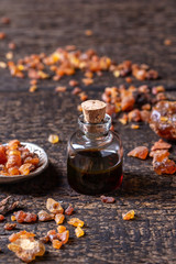 A bottle of myrrh essential oil with myrrh resin