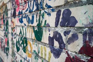 Wall with handprints on a playground.
