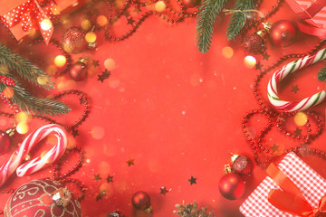 Christmas decorations on red background, top view