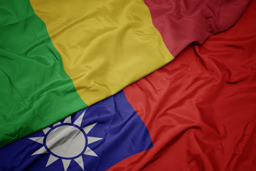 waving colorful flag of taiwan and national flag of mali.